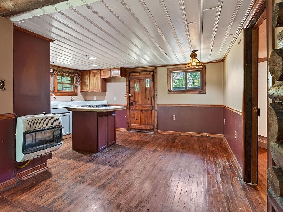 Kitchen with an island and wood cabinets