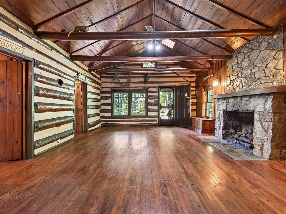 Another view of the living room and fireplace