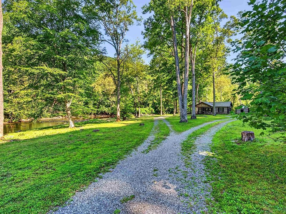 Gravel approach and grounds around the cabin